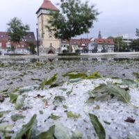 Summer storm leaves streets coated in a foot of hail