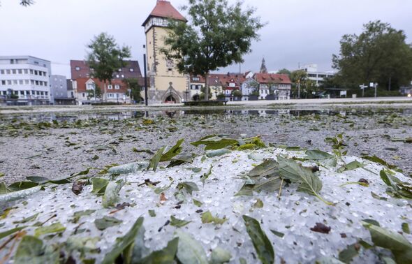 Summer storm leaves streets coated in a foot of hail