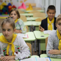To forge bonds, Ukraine tries to bring kids back into schools – safely